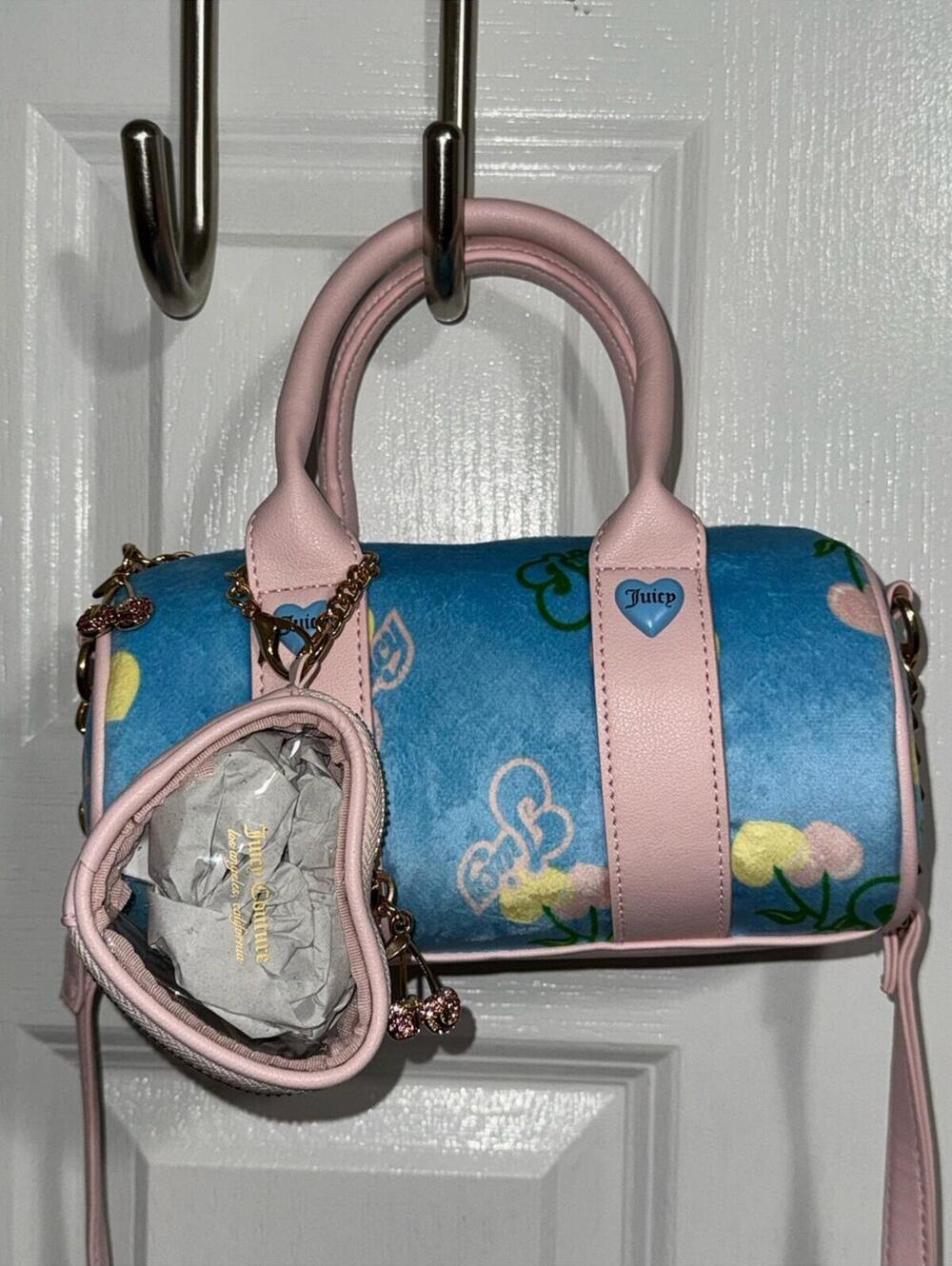 Brand new without tags Juicy Couture mini barrel crossbody bag with bag charm.